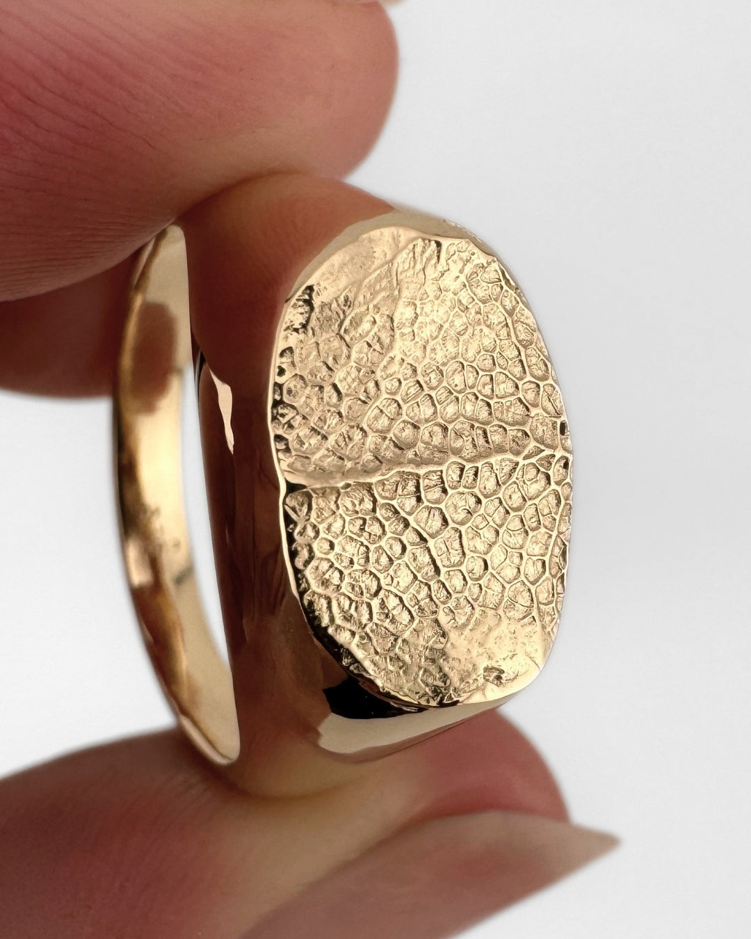 Gold oval signet ring with dog's nose print impression
