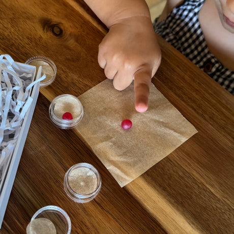 Child taking a wax fingerprint impression