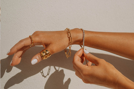 Lady wearing jewellery bracelets and rings