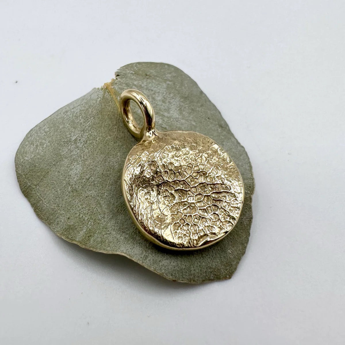 9ct Gold pendant made from a dogs nose impression