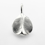 Double sided silver fingerprint pendant on light grey background