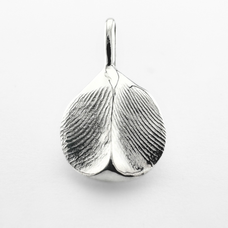 Double sided silver fingerprint pendant on light grey background