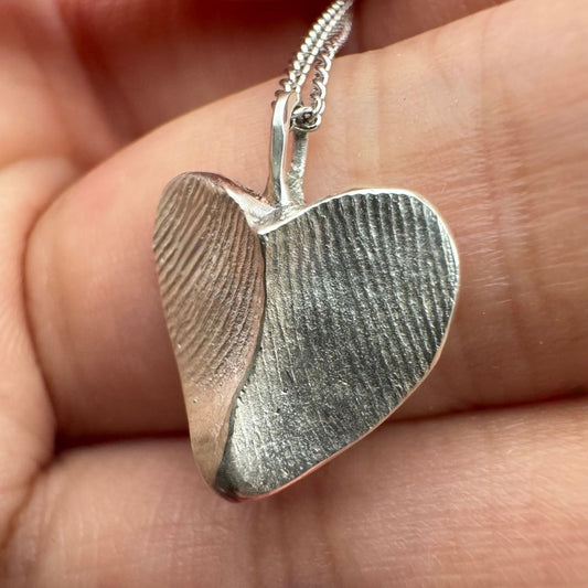 Double sided heart shaped fingerprint pendant in silver