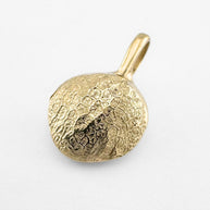 Gold dog's nose print pendant on light grey background