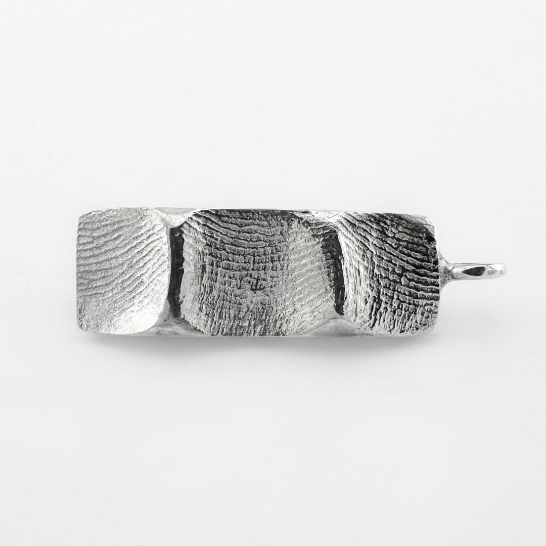 Silver family fingerprint bar pendant on light grey background