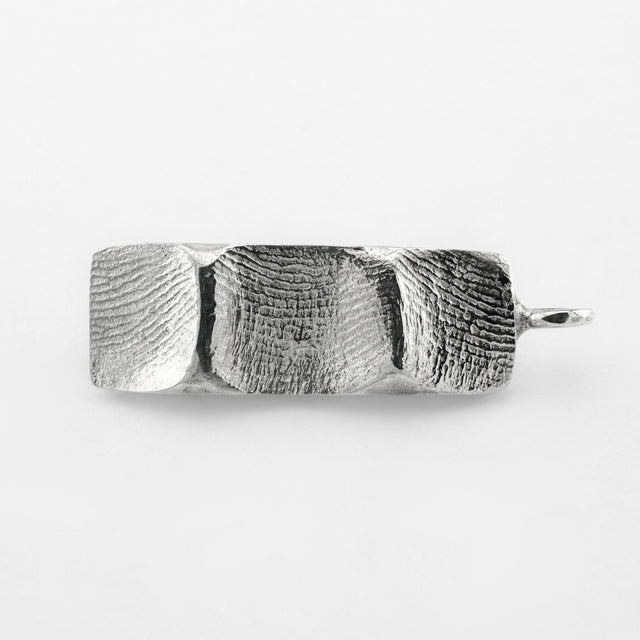 Silver family fingerprint bar pendant on light grey background