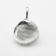 Silver fingerprint pendant on light grey background