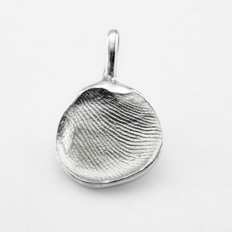 Silver fingerprint pendant on light grey background