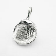 Silver fingerprint pendant on light grey background