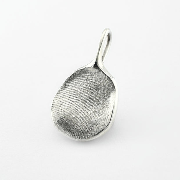 Silver fingerprint pendant on light grey background