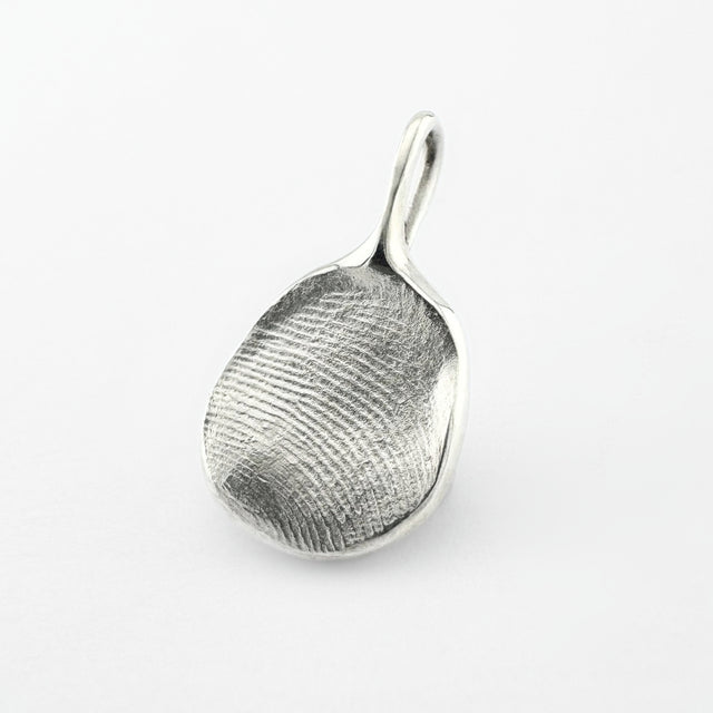 Silver fingerprint pendant on light grey background