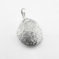 Silver dog's nose print pendant on light grey background