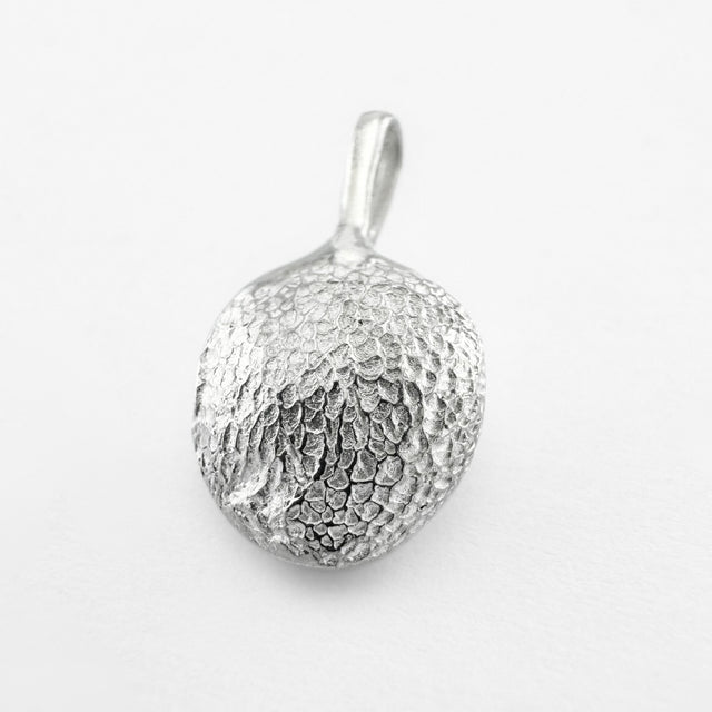 Silver paw print pendant on light grey background