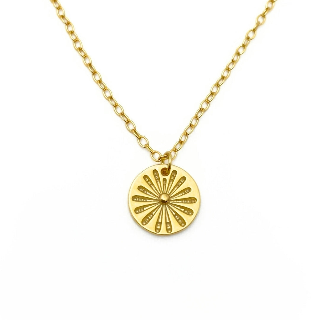 Gold necklace with small flower pendant