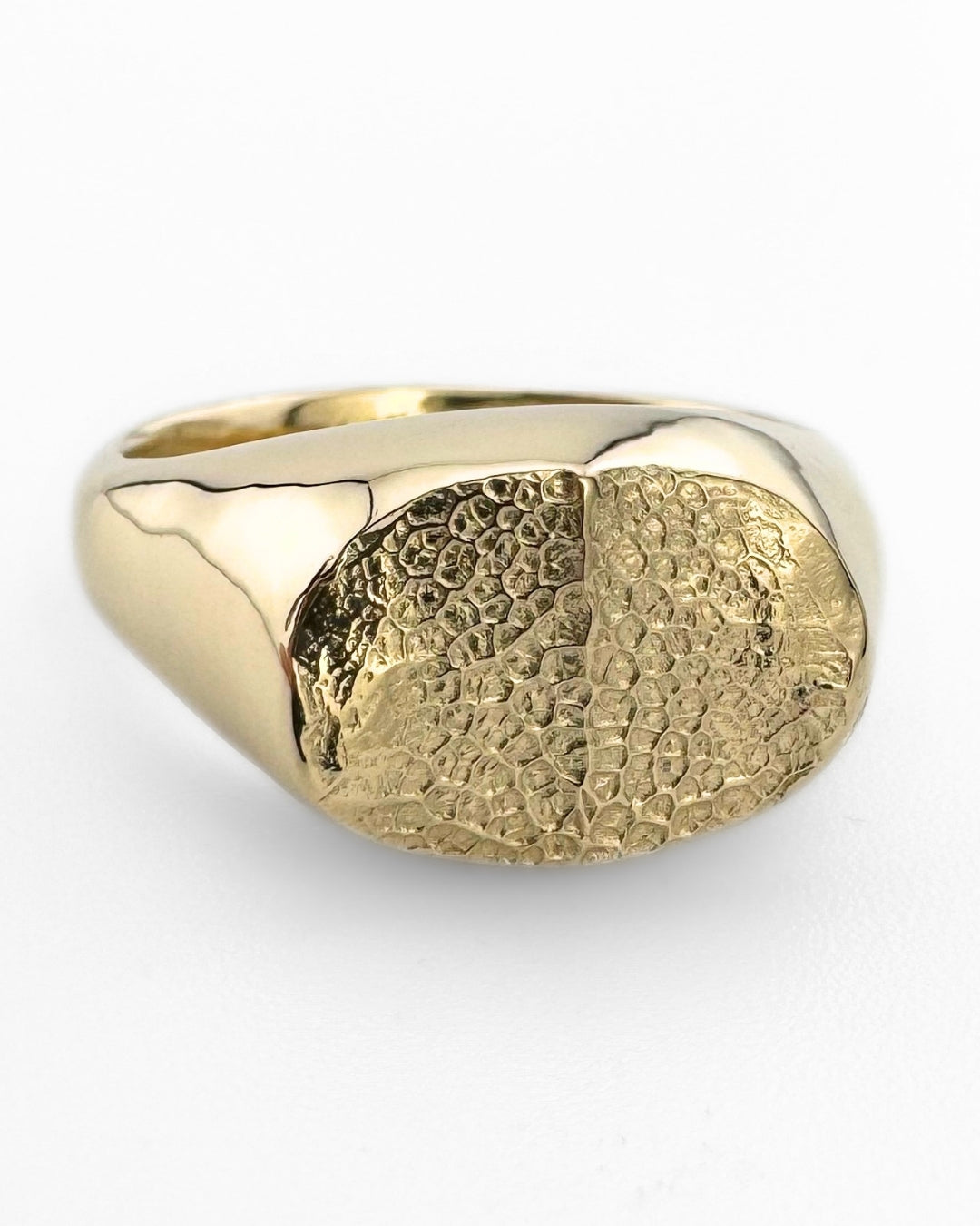 Gold oval signet ring with dog's nose print impression