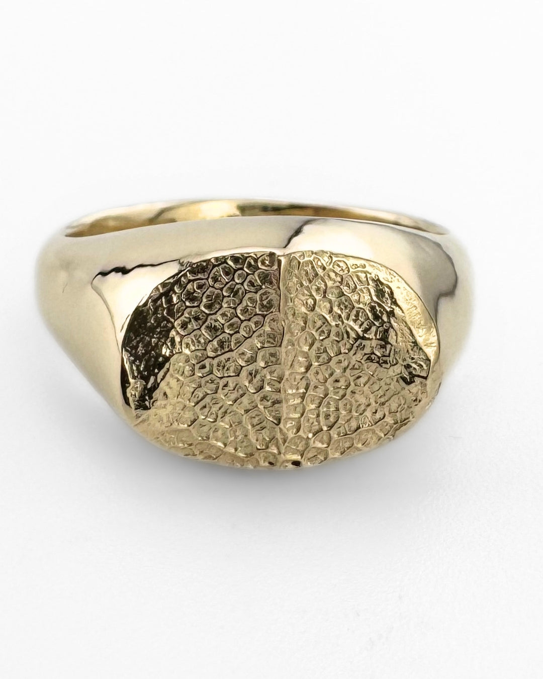 Gold oval signet ring with dog's nose print impression