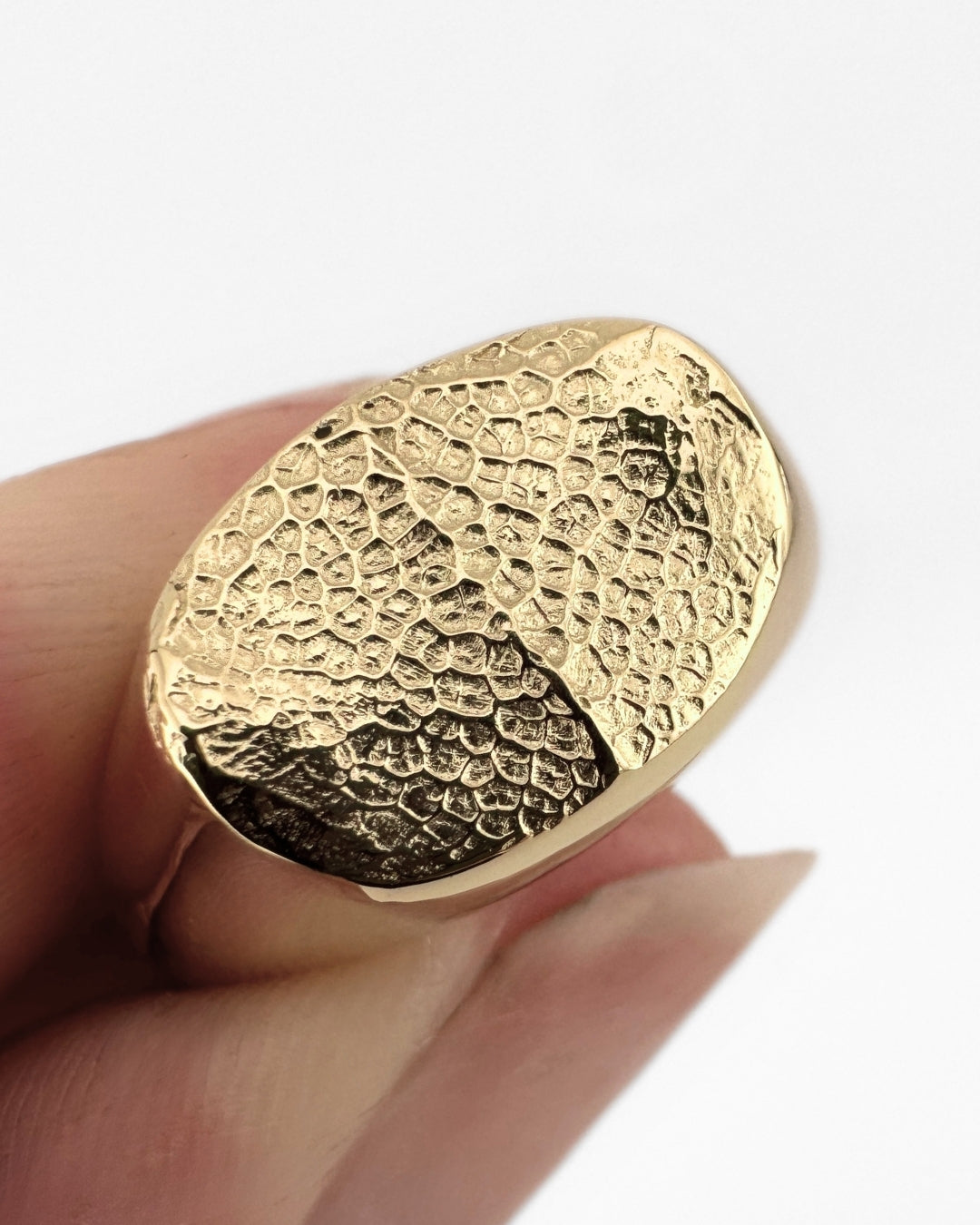Gold oval signet ring with dog's nose print impression