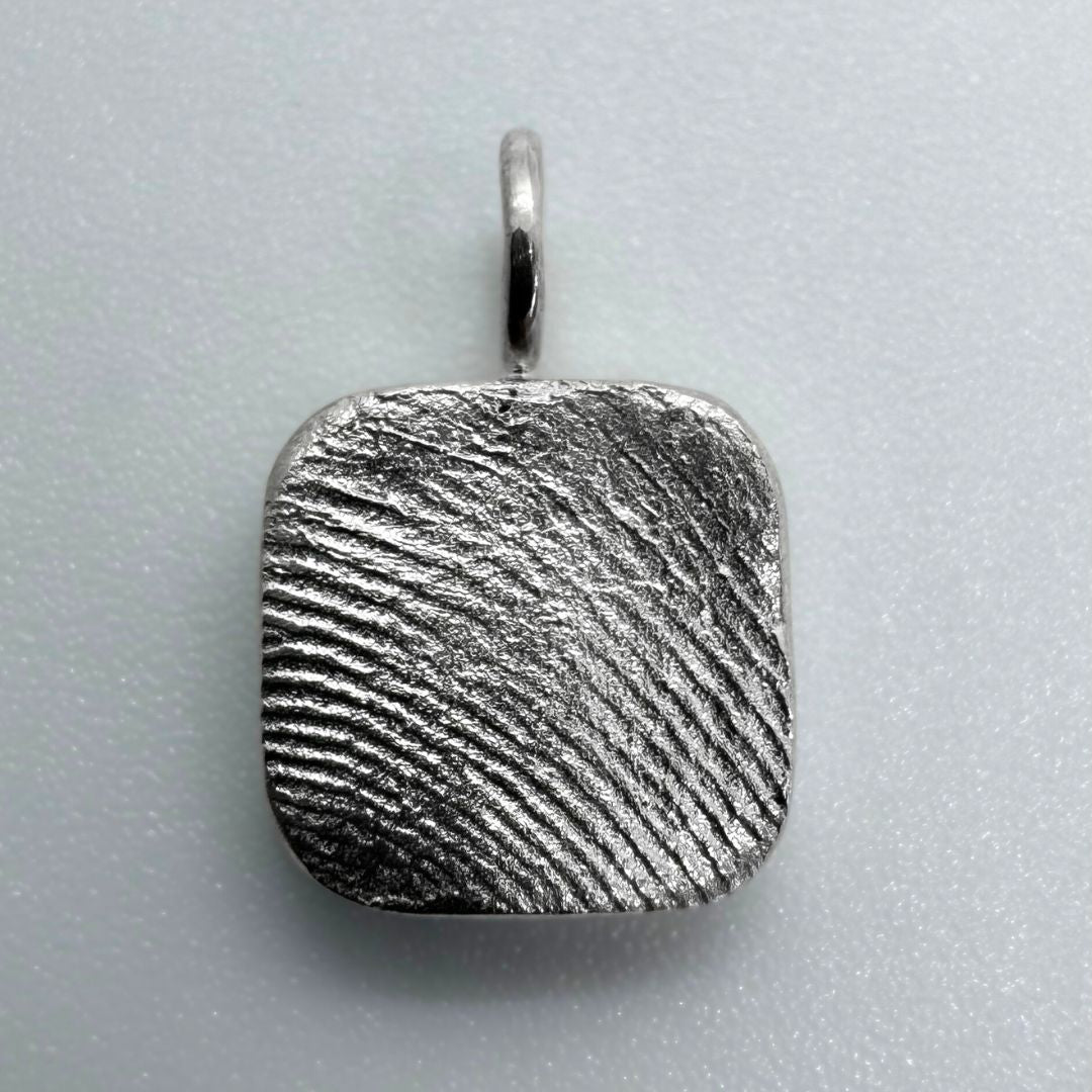 Square sterling silver fingerprint pendant on white background