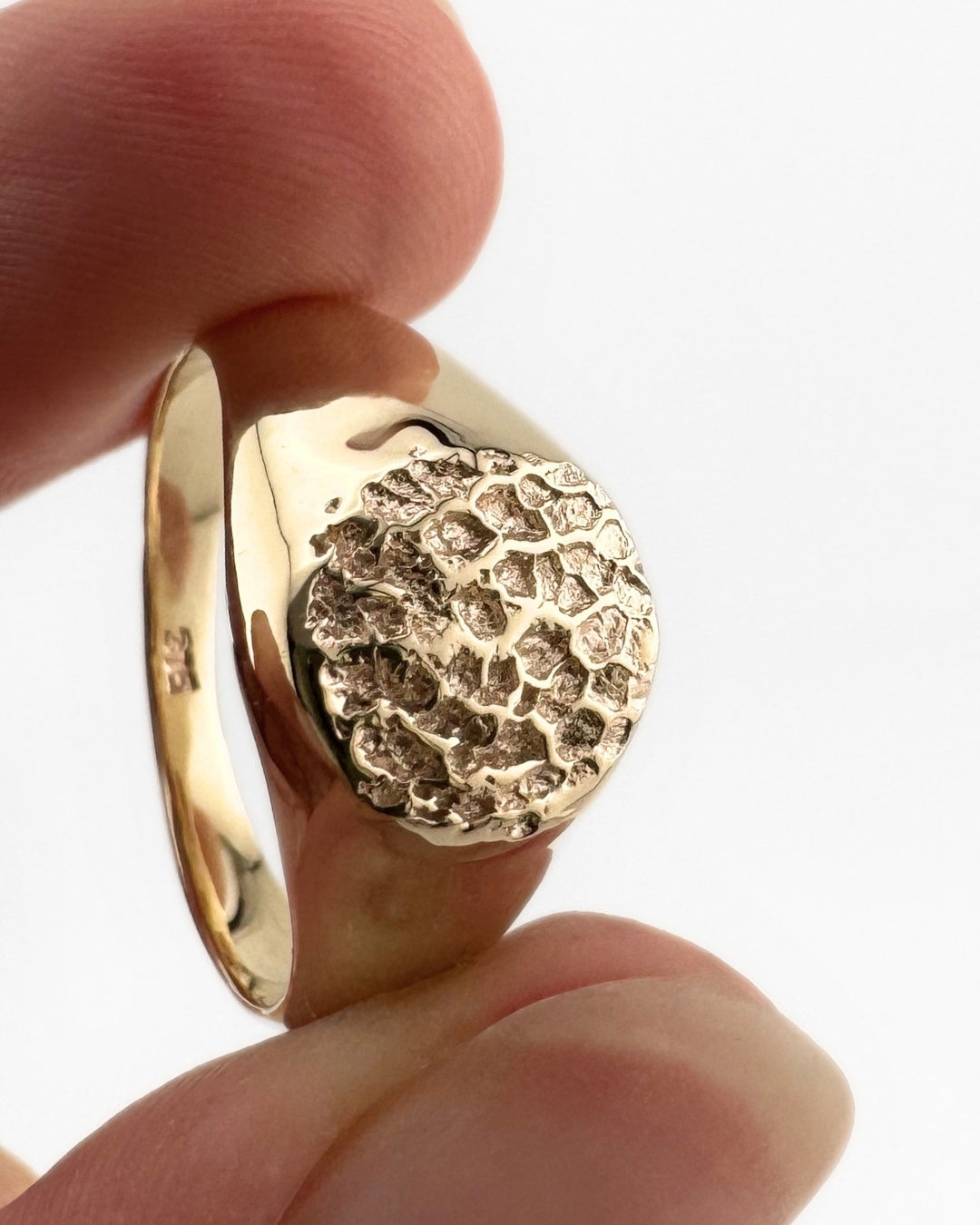 Small gold signet ring with dog's nose print impression