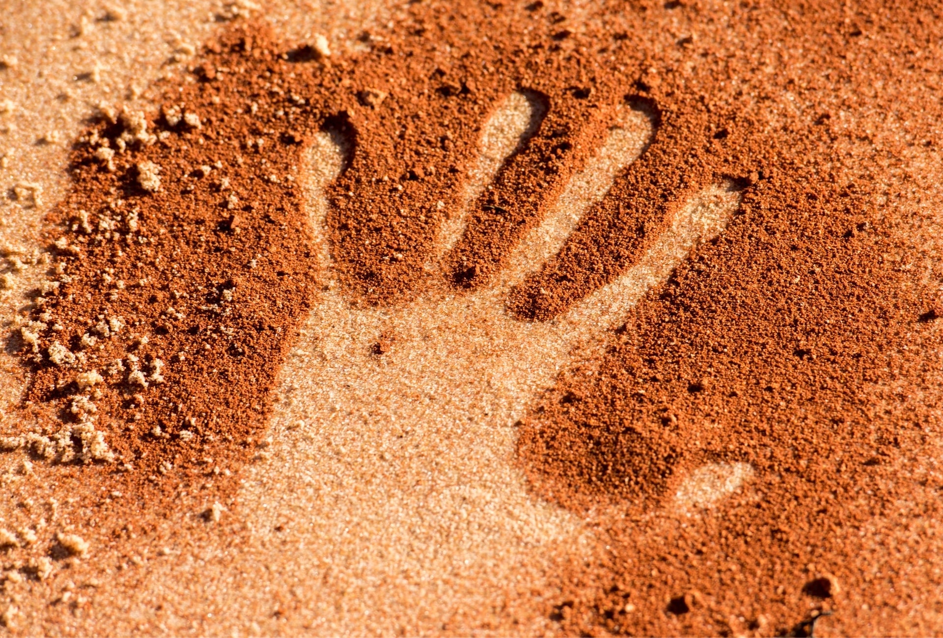 Australian red sand with handprint