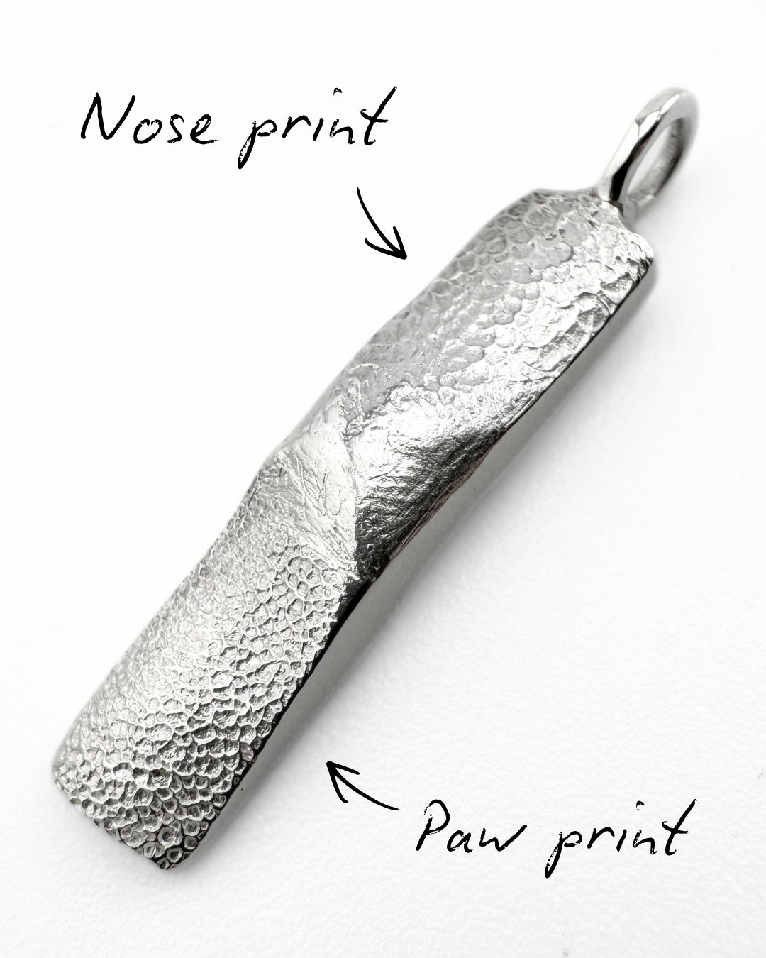Rectangular silver pendant with a dog's paw and nose print impression