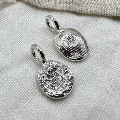 Sterling silver dog's nose and paw print pendants