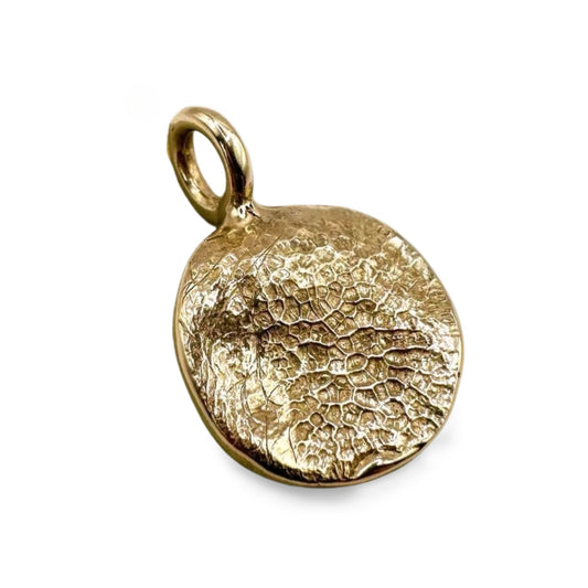 Gold dog's nose print pendant on transparent background