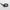 Black plastic ring sizer on light grey background