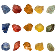 Rough coloured sapphires on white background