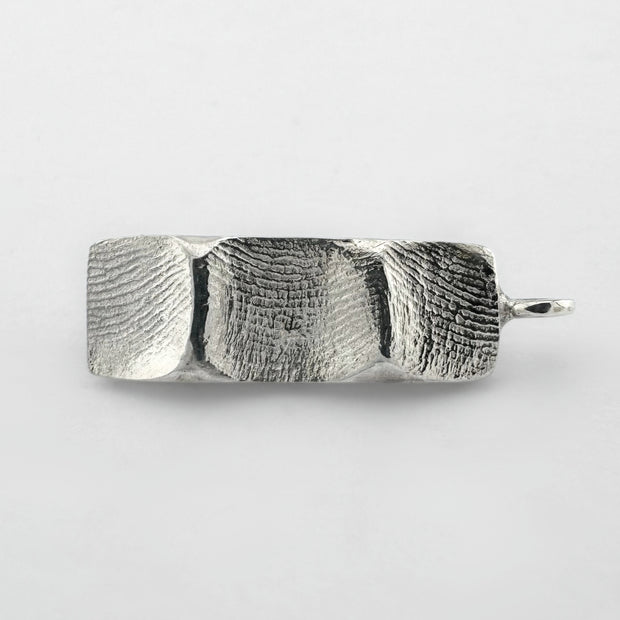 Sterling silver family fingerprint pendant on light grey background