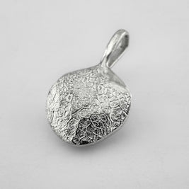 Sterling silver dogs nose print pendant on light grey background