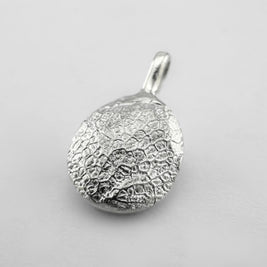 Sterling silver dogs nose print pendant on light grey background