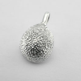 Sterling silver dogs paw print pendant on light grey background