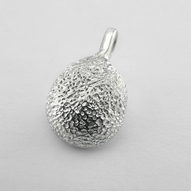 Sterling silver dogs paw print pendant on light grey background