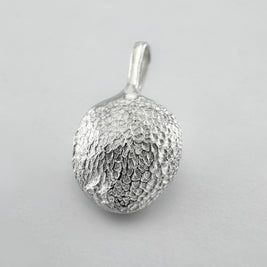Sterling silver dogs paw print pendant on light grey background