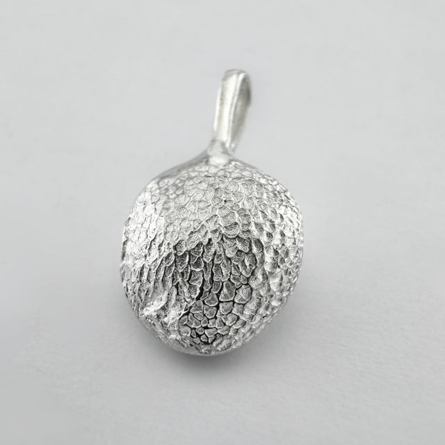 Sterling silver dogs paw print pendant on light grey background