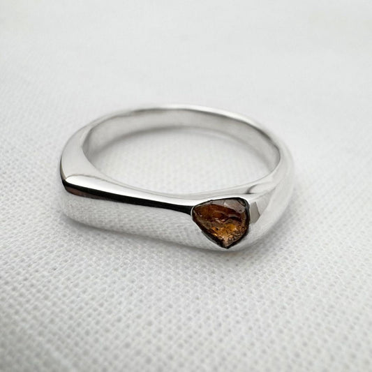 Thin silver signet ring with rough sapphire