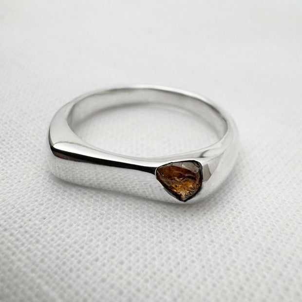 Thin silver signet ring with rough sapphire