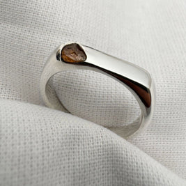 Thin silver signet ring with rough sapphire