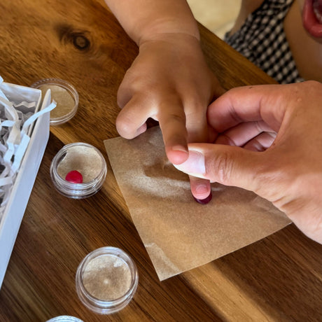 Child taking a wax fingerprint impression