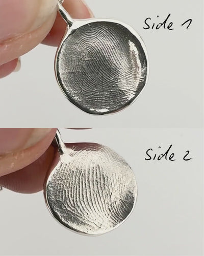 Split screen of the front and back of a double sided silver fingerprint pendant